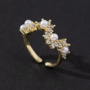 Elegant gold adjustable ring with white pearls and sparkling cubic zirconia stones