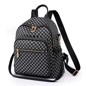 Women's black floral backpack with geometric print, gold zippers, and large capacity