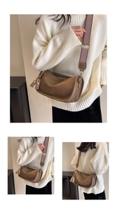 Detail of vintage brown saddle bag with geometric woven strap and silk scarf accent