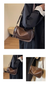 Close-up of brown faux leather saddle bag with vintage texture and tassel detail