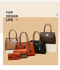 Close-up of leopard print details and metal clasp on textured leather handbag set