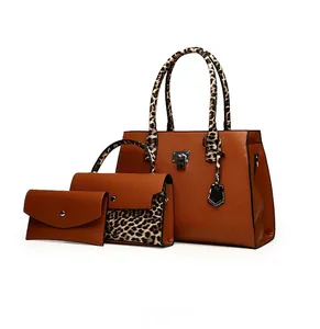 Detailed view of 3-piece bag set with leopard print accents and brown pebble texture