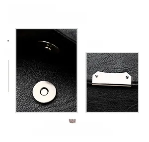 Détail de la fermeture magnétique argentée et du cuir grainé du petit sac bandoulière noir