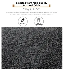 Gros plan sur cuir synthétique grainé noir montrant la texture durable et résistante