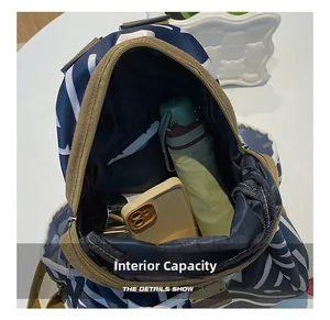 Internal capacity of the printed oxford backpack showing storage for daily essentials