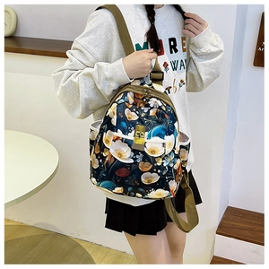 Detail of floral oxford backpack with metal buckles and adjustable canvas straps