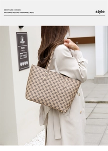 Street style view of a large checkerboard tote bag with elegant geometric pattern