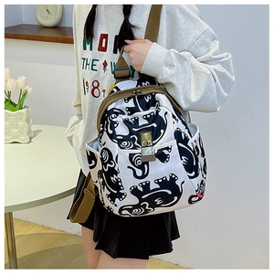 Detail of printed Oxford fabric backpack with olive green straps and metal adjusters