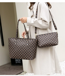 Detail of checkered tote and crossbody set with polished PU leather and slim handles