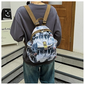 Detail of artistic ink landscape print on oxford fabric backpack for travel and outdoor use