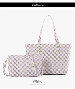 Detailed view of white checkered pattern tote and crossbody bag set with gold hardware