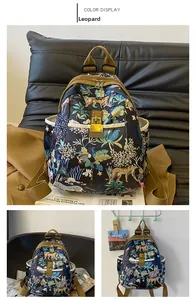 Detail of tropical leopard print backpack with durable oxford fabric and metal buckle closure