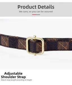 Macro detail of adjustable brown checkered shoulder strap with golden metal buckle