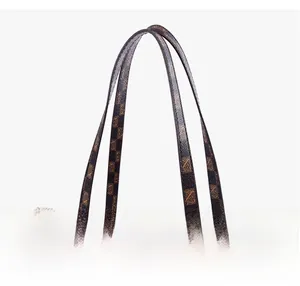 Close-up of flexible soft handles and checkerboard pattern on large tote bag