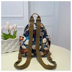 Floral oxford backpack with back anti-theft zipper pocket and brown woven straps