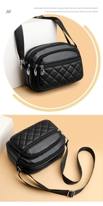 Close-up of black quilted leather crossbody bag with three zipper compartments and wide strap