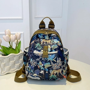 Fashionable floral Oxford backpack for women with tropical jungle prints and metal lock