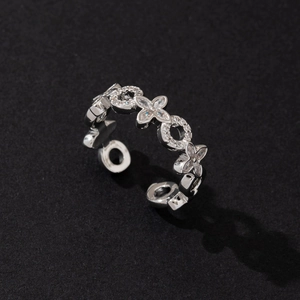 Macro shot of silver hexagram ring featuring intricate diamond flower and ring patterns