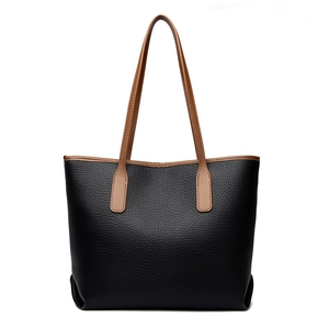 Borsa tote minimalista in pelle martellata nera con manici marroni per pendolari eleganti