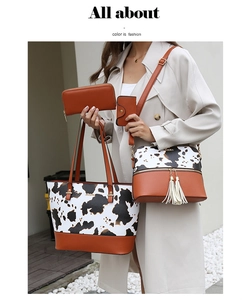 Ensemble détaillé de quatre sacs avec motifs vache et accents en cuir caramel
