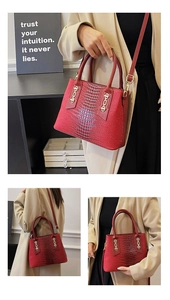 Detail of dark red tote bag with crocodile texture, gold chain accents and adjustable strap