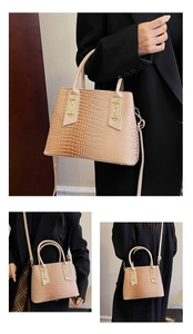Detail of apricot crocodile pattern handbag with gold chain and adjustable shoulder strap