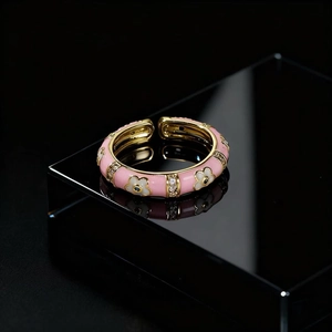 Vintage floral open ring with pink enamel and sparkling zircon accents in golden finish