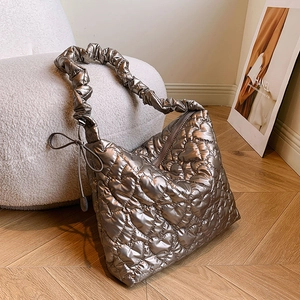 Metallic silver hobo bag with heart quilted texture and ruched shoulder strap
