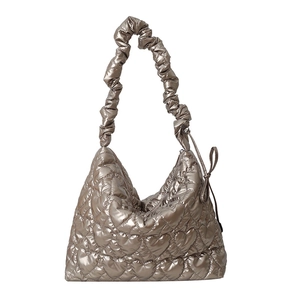 Quilted heart pattern metallic shoulder bag with champagne gold finish and scrunchie strap