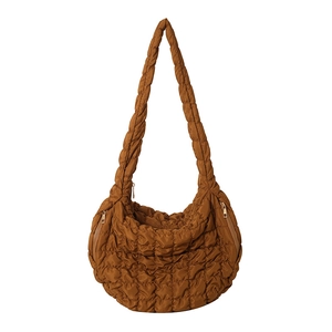 Quilted caramel brown cloud hobo bag with wide shoulder strap and metal zipper
