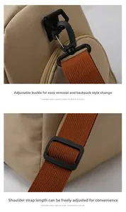 Detail of detachable shoulder strap with swivel hook and adjustable buckle on travel bag