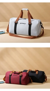 Detail of multi-color oxford duffel bags with separate shoe compartments for travel