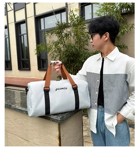 Detail view of large Oxford travel tote bag with separate shoe compartment and blue finish