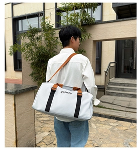 Outdoor lifestyle shot of a large Oxford travel tote bag with wet-dry separation feature