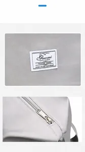 Detail view of zinc alloy zippers and reinforced fabric on the large gym travel bag