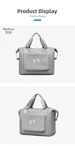 Detail view of medium grey waterproof travel bag with large capacity and logo pocket