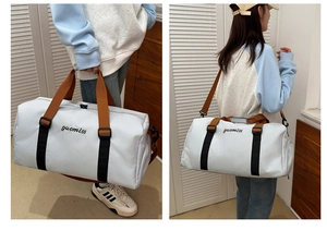 Oxford travel tote bag detail with dual handles and adjustable shoulder strap