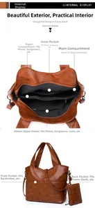 Detailed interior view of brown tote bag showing multiple pockets and zipped compartments
