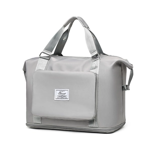 Bolsa de deporte grande gris en nailon impermeable con asas y bolsillo frontal