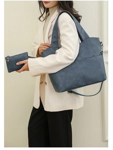 Detail of grey-blue textured PU leather tote bag set including a matching zipper pouch