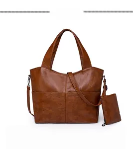 Front view of caramel brown large capacity tote bag with matching zippered pouch set