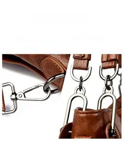 Detail of gunmetal hardware and lychee pattern leather on brown shoulder bag