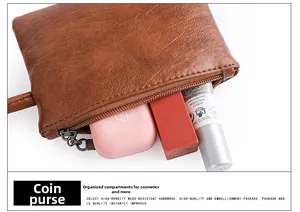 Brown litchi leather cosmetic pouch showing interior space for lipsticks and accessories