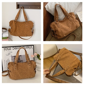 Detail of vintage brown large tote bag featuring silver rivets and versatile straps