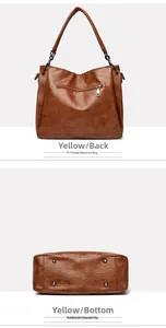 Detail view of large brown PU leather tote bag featuring rear zip pocket and protective base studs