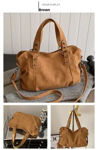 Detail of brown vintage tote with silver rivets and adjustable strap on a cozy background