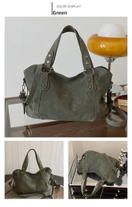 Detail of green frosted tote bag with metal rivets and vintage leather texture