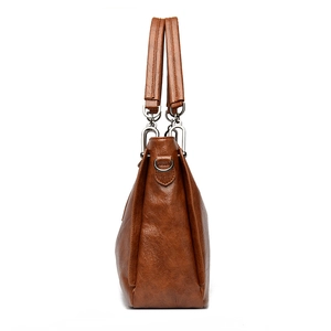 Brown litchi grain leather shoulder bag for women with silver hardware side view