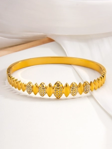 Macro shot of 18k gold plated stainless steel bracelet with square crystal settings