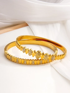 Macro detail of gold PVD plated stainless steel bracelets with sparkling cubic zirconia